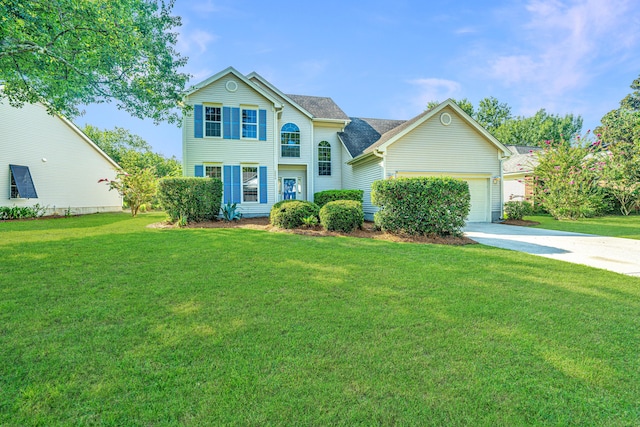 view of front of property with a garage and a front yard