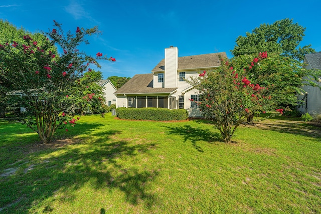 view of yard featuring a sunroom