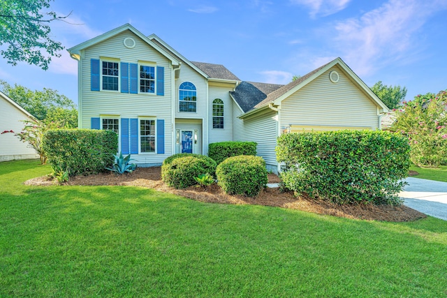 front facade with a front yard