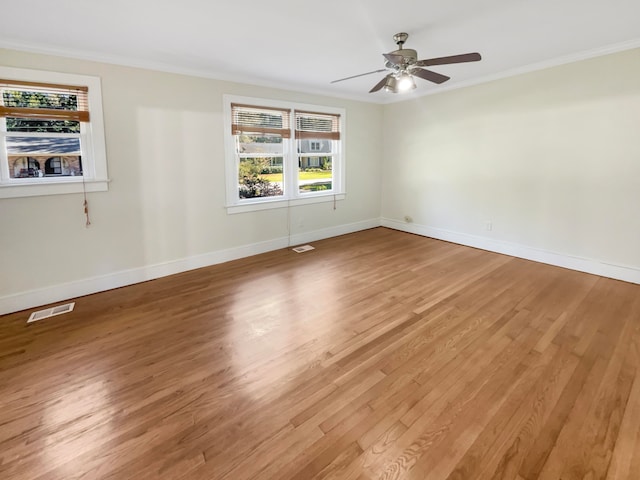 spare room featuring ornamental molding, wood-type flooring, and ceiling fan