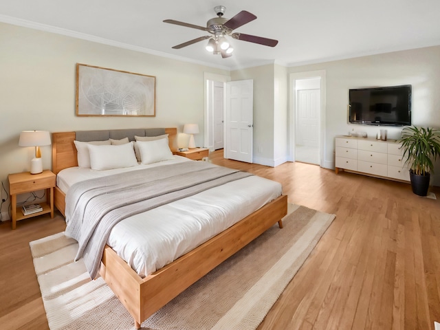 bedroom with light hardwood / wood-style flooring, crown molding, and ceiling fan