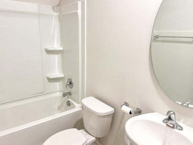 full bathroom featuring toilet, washtub / shower combination, and sink