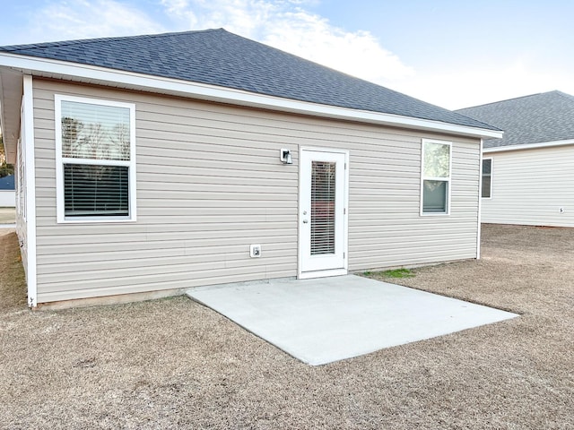 rear view of property featuring a patio