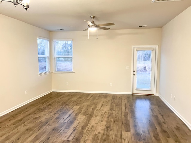 unfurnished room featuring ceiling fan and dark hardwood / wood-style floors