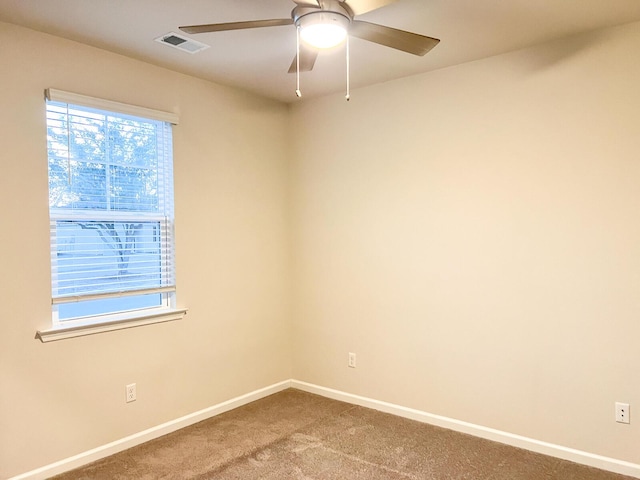 empty room with carpet flooring and ceiling fan