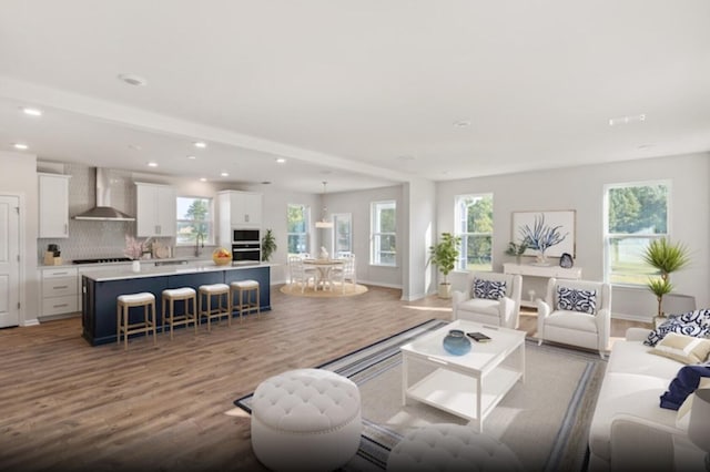 living room with light wood-type flooring and sink