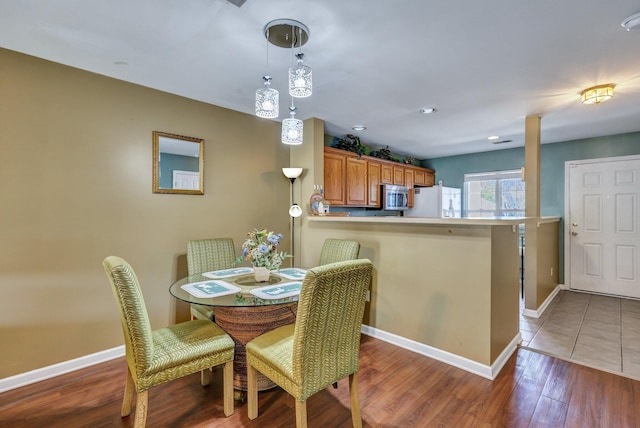 dining area featuring dark hardwood / wood-style flooring