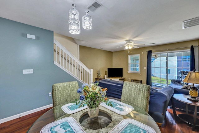 dining area featuring hardwood / wood-style flooring and ceiling fan