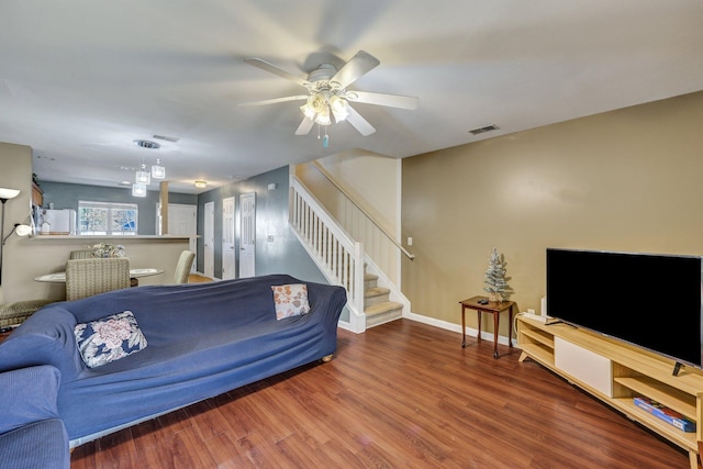 living room with ceiling fan and wood-type flooring