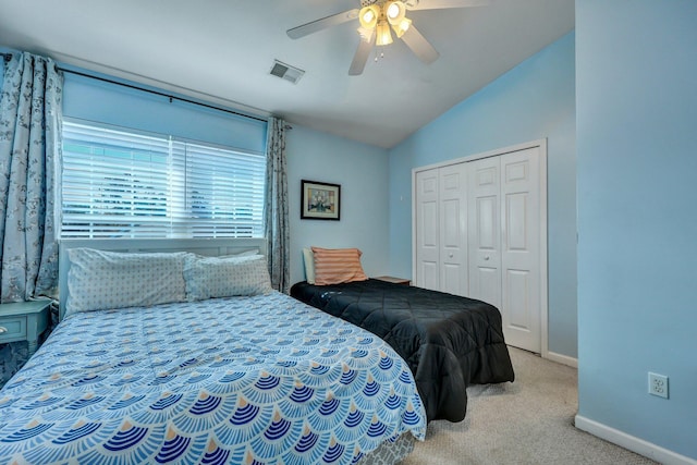 bedroom featuring vaulted ceiling, carpet floors, ceiling fan, and a closet