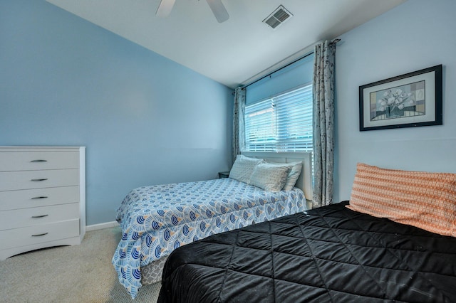 carpeted bedroom featuring lofted ceiling and ceiling fan