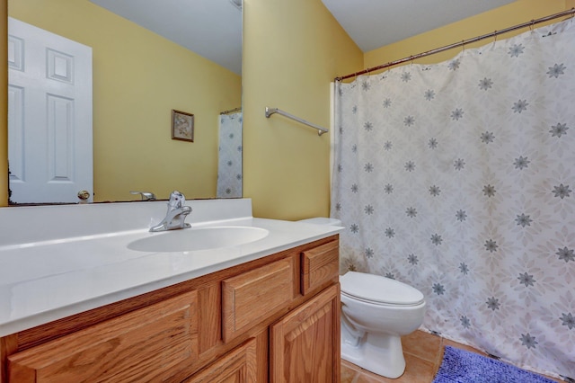 bathroom featuring tile patterned floors, toilet, and vanity