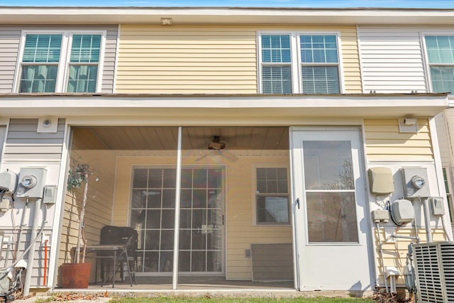 doorway to property featuring central AC unit