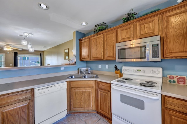 kitchen featuring sink, white appliances, ceiling fan, and light tile patterned flooring