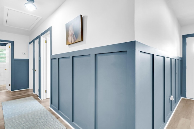 corridor with light hardwood / wood-style floors