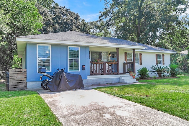 single story home featuring a front lawn and a porch