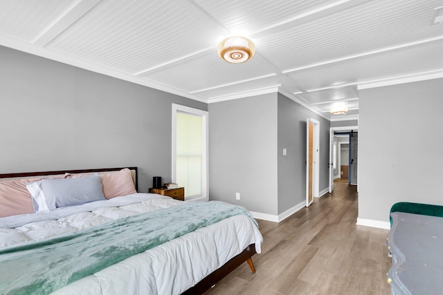 bedroom featuring ornamental molding and hardwood / wood-style flooring