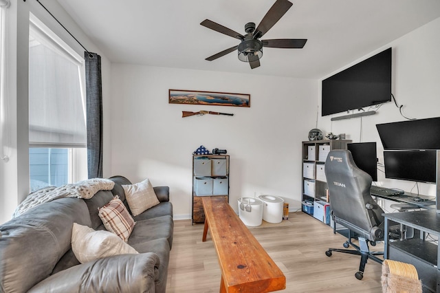 office area with ceiling fan and light hardwood / wood-style floors