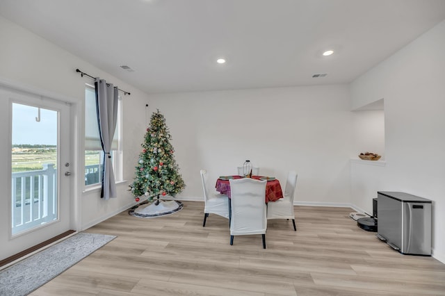 dining area with light wood-type flooring