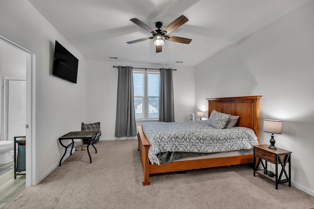 bedroom featuring light colored carpet and ceiling fan