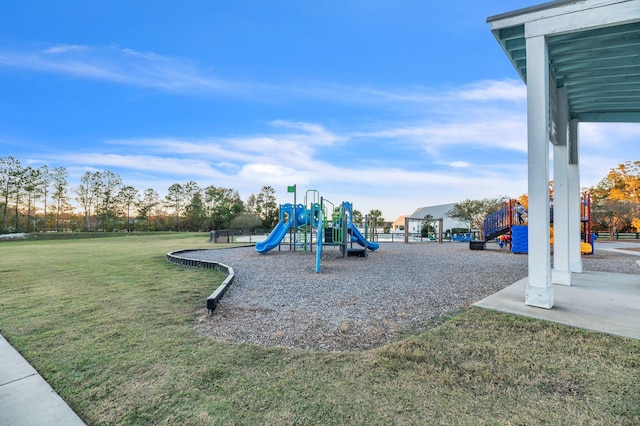 view of jungle gym featuring a lawn