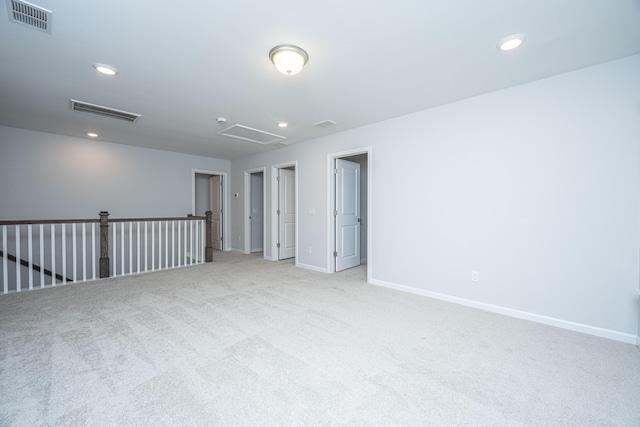 unfurnished room with light colored carpet