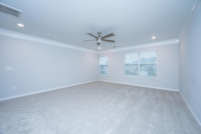 carpeted spare room with ornamental molding and ceiling fan