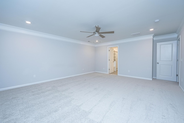 carpeted empty room with crown molding and ceiling fan