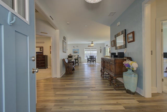 entrance foyer featuring baseboards, ceiling fan, and wood finished floors