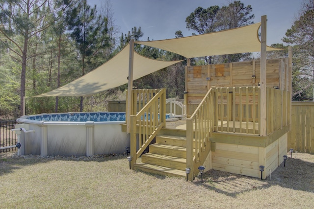 exterior space with a wooden deck and fence