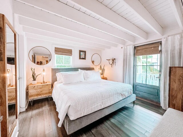 bedroom with dark wood-type flooring and beamed ceiling