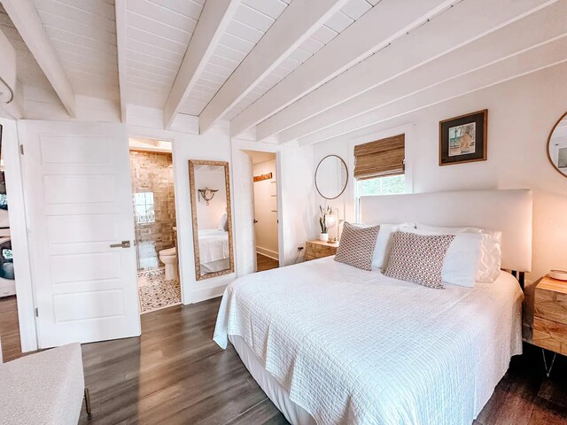 bedroom featuring ensuite bathroom, dark hardwood / wood-style floors, and beamed ceiling