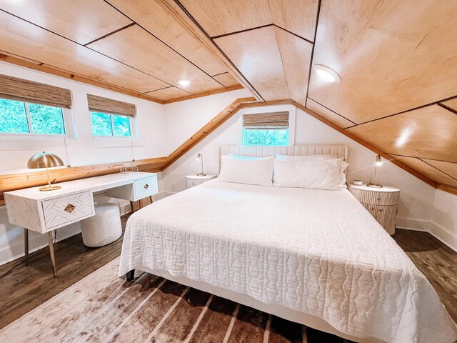 bedroom featuring dark hardwood / wood-style floors, lofted ceiling, and wood ceiling