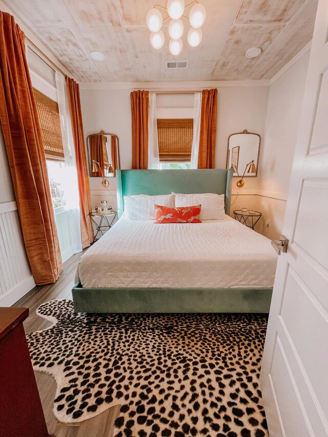 bedroom with wood-type flooring