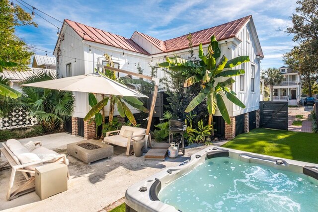 view of swimming pool with an outdoor fire pit