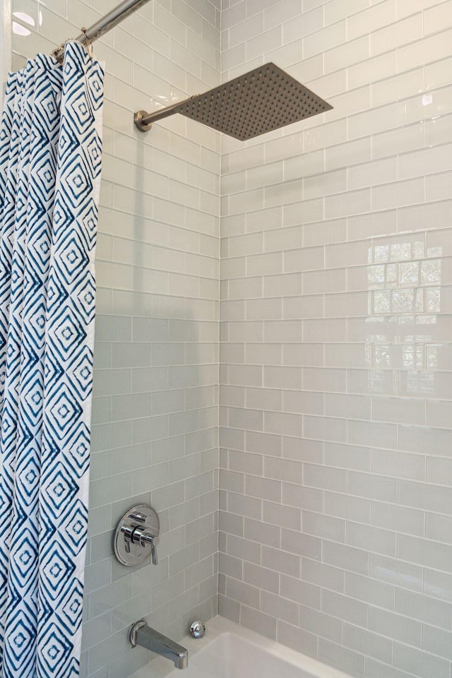 bathroom with shower / tub combo