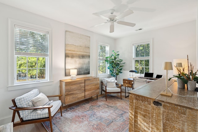 interior space with ceiling fan and hardwood / wood-style flooring