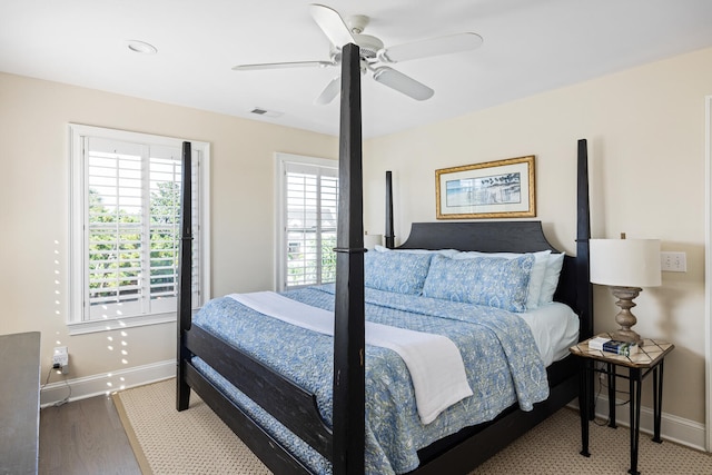 bedroom featuring ceiling fan and dark hardwood / wood-style floors