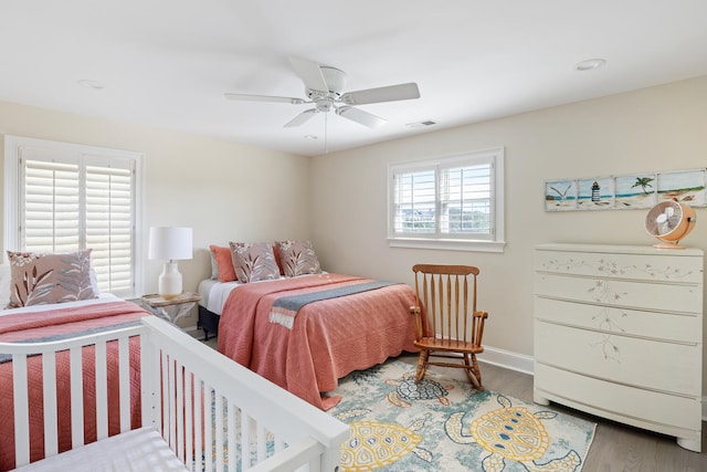 bedroom with ceiling fan and hardwood / wood-style flooring