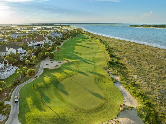 birds eye view of property with a water view and a view of the beach