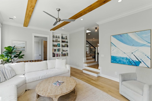 living area with stairs, beam ceiling, ceiling fan, recessed lighting, and light wood finished floors