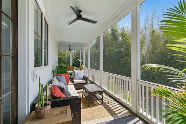 sunroom featuring ceiling fan and outdoor lounge area