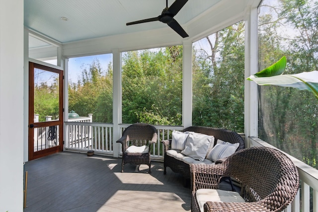 sunroom with a ceiling fan