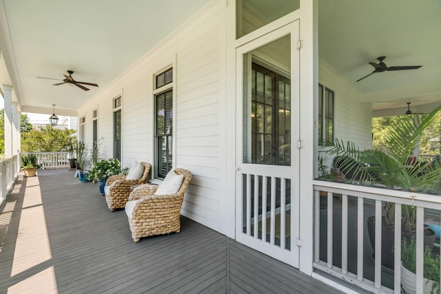 deck with a porch and a ceiling fan
