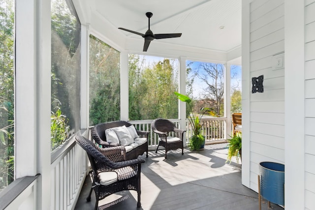sunroom with a ceiling fan