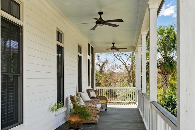 deck featuring a porch and a ceiling fan