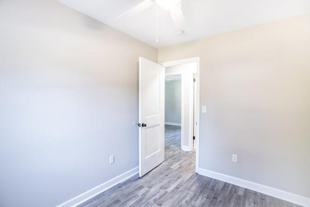 unfurnished room featuring wood-type flooring and ceiling fan