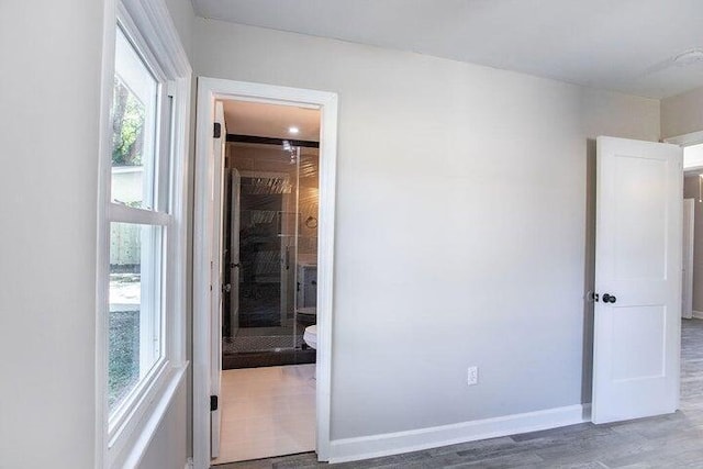 unfurnished bedroom featuring dark wood-type flooring and a closet