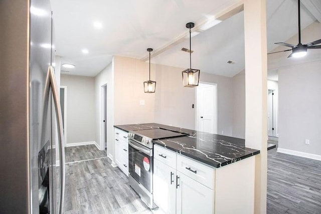 kitchen with pendant lighting, white cabinetry, dark stone countertops, stainless steel appliances, and light wood-type flooring