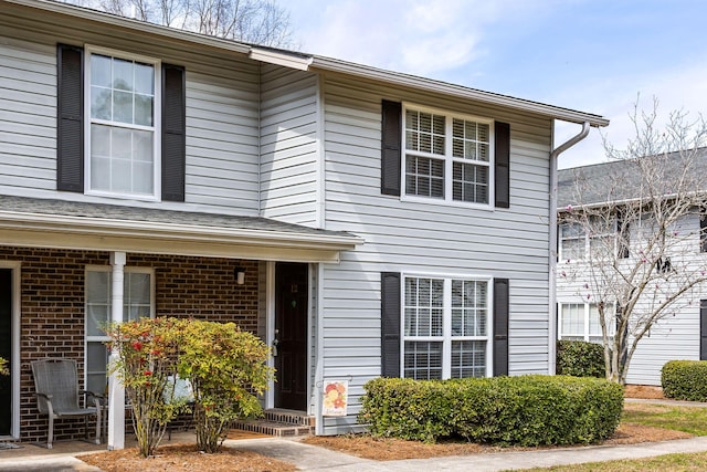 view of front of house featuring brick siding